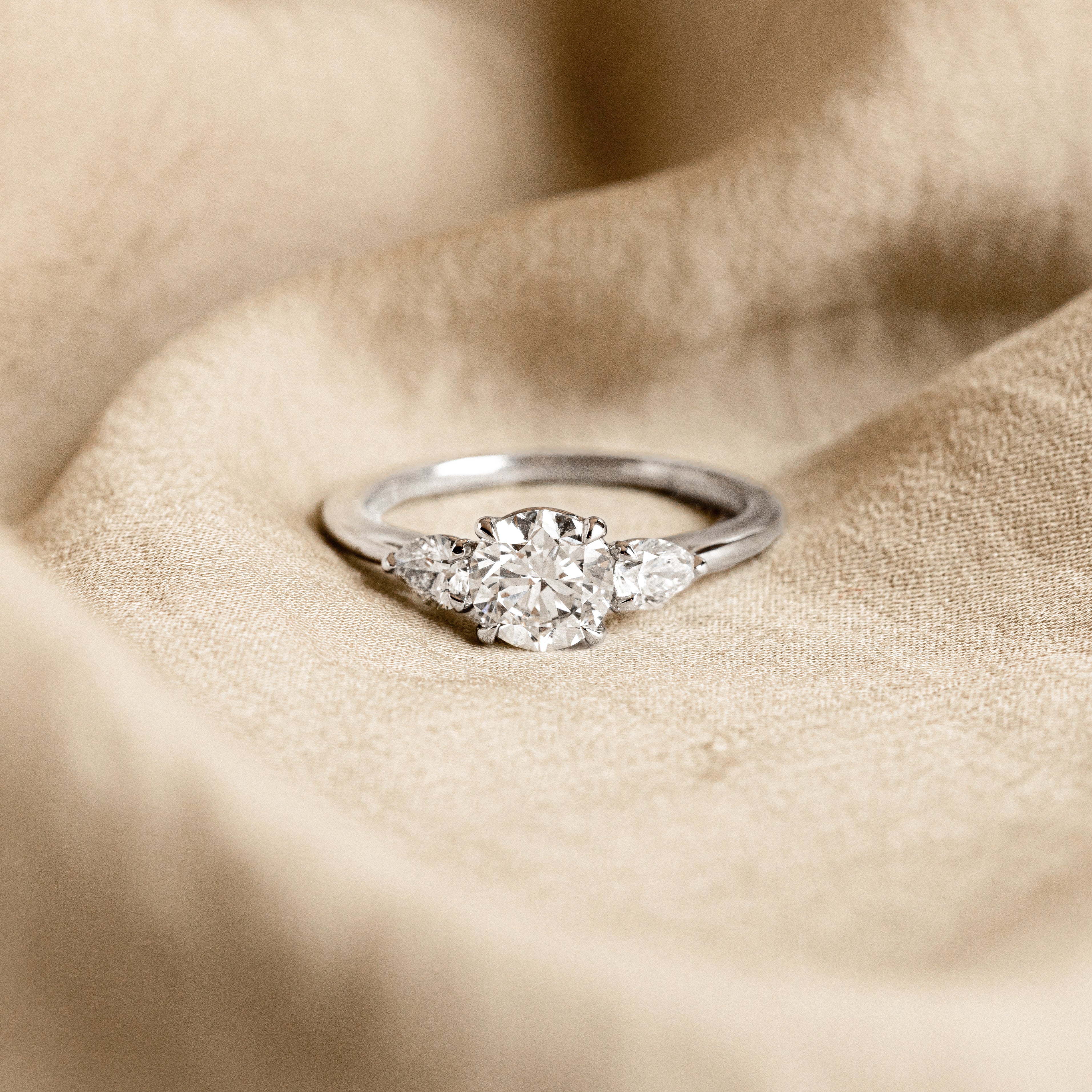 1.04 Carat Round Brilliant Diamond Three Stone Pear Accent Engagement Ring in Platinum -  Replica Handbags 